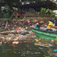 Members of the Cruise and Clean Team of Lekki Youth Association trawl for waste in Five Cowrie Creek, Lag